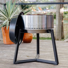 Load image into Gallery viewer, Solo Stove Grill Ultimate Bundle - Full Frontal View Of Grill, Large Stand, And Cover - On A Deck In Front Of Some Plants